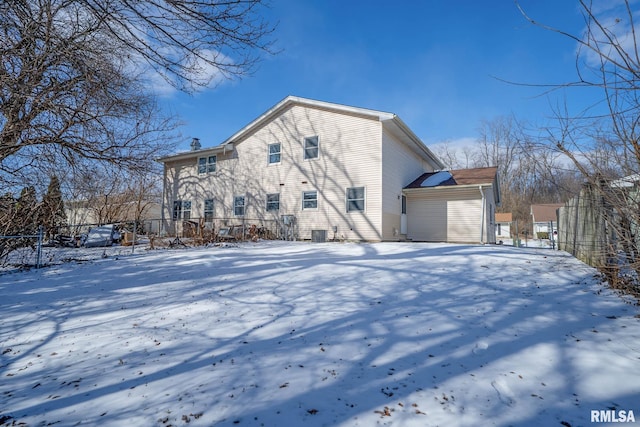 snow covered property featuring a chimney