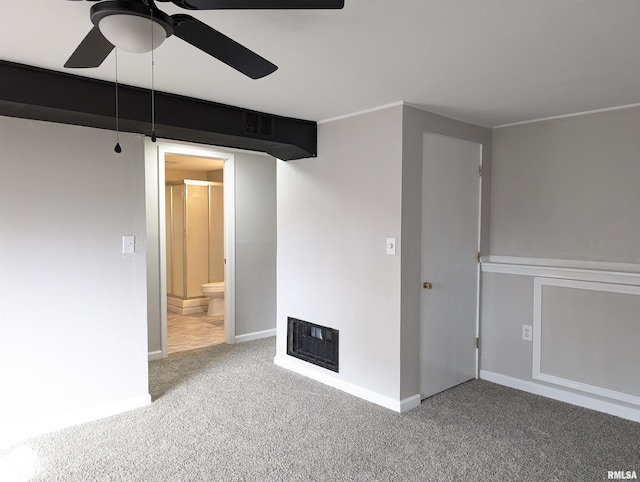 unfurnished room with ceiling fan, carpet, and heating unit