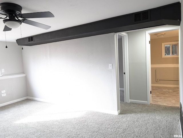 carpeted empty room with ceiling fan