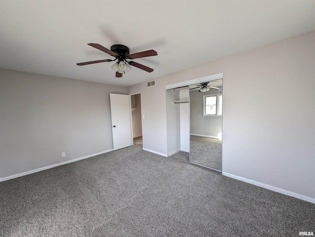 unfurnished bedroom with ceiling fan, a closet, and carpet