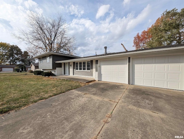 tri-level home with a front lawn and a garage