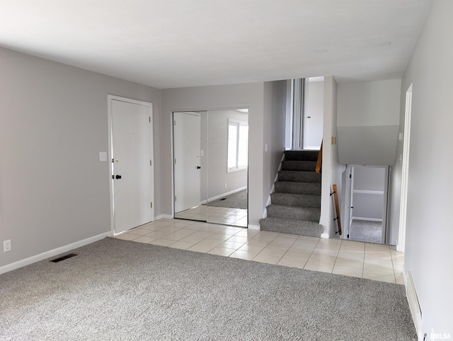 view of carpeted foyer entrance