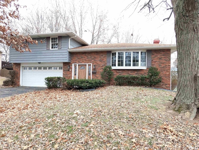 split level home featuring a garage