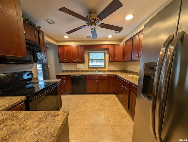 kitchen featuring ceiling fan, sink, light stone counters, and black appliances