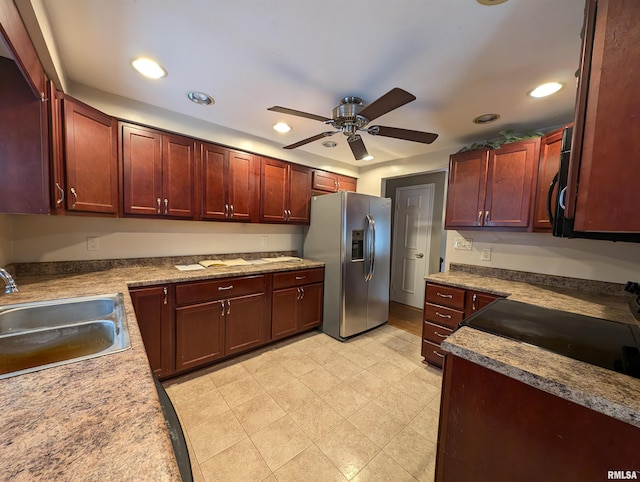 kitchen with stainless steel fridge with ice dispenser, ceiling fan, stove, and sink