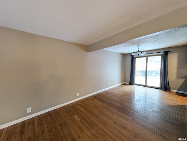 unfurnished room featuring hardwood / wood-style flooring, beamed ceiling, and a chandelier