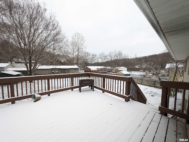 view of snow covered deck