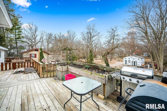 wooden deck featuring area for grilling