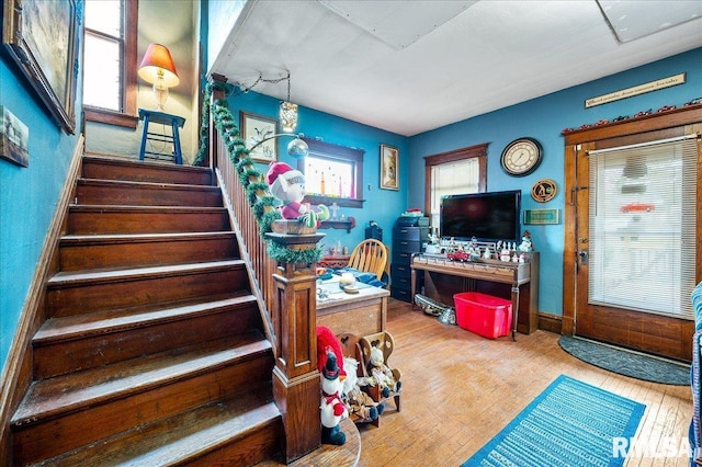 stairway featuring hardwood / wood-style flooring