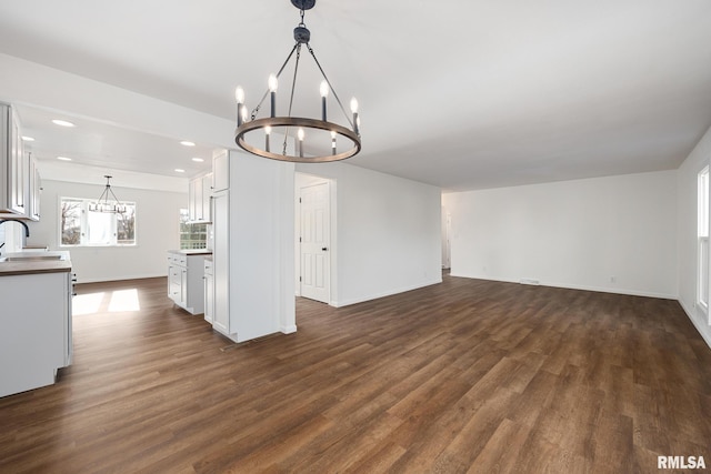 interior space with sink, a chandelier, and dark hardwood / wood-style floors