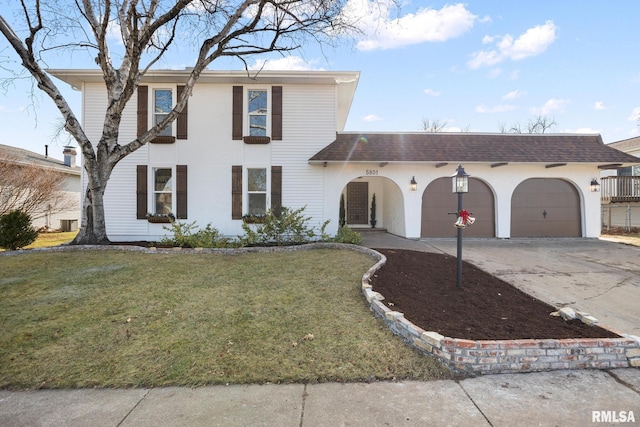 view of front facade featuring a front lawn and a garage