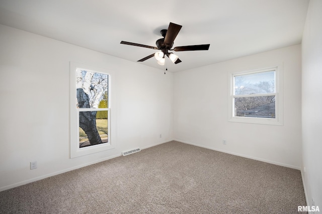 carpeted empty room with ceiling fan