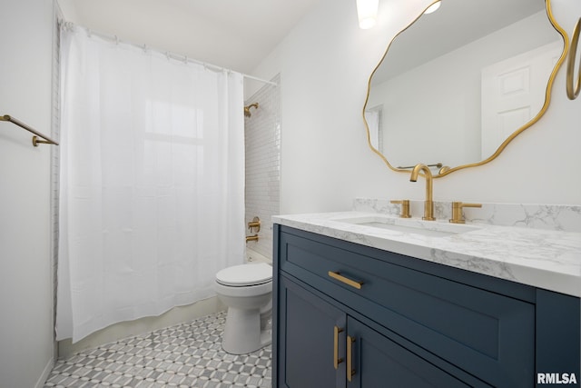 full bathroom featuring tile patterned flooring, vanity, toilet, and shower / tub combo