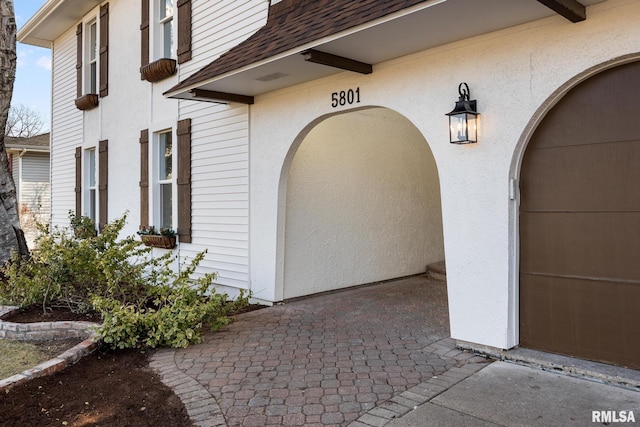 property entrance featuring a patio