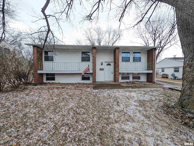 bi-level home with brick siding