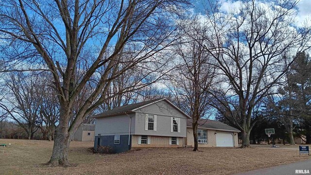 split level home featuring a garage