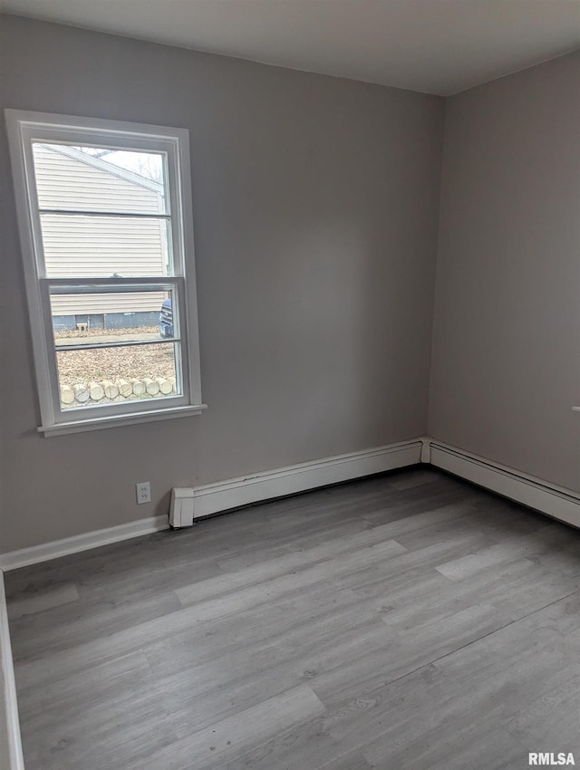 spare room with light wood-type flooring