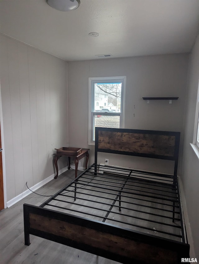 bedroom featuring hardwood / wood-style floors