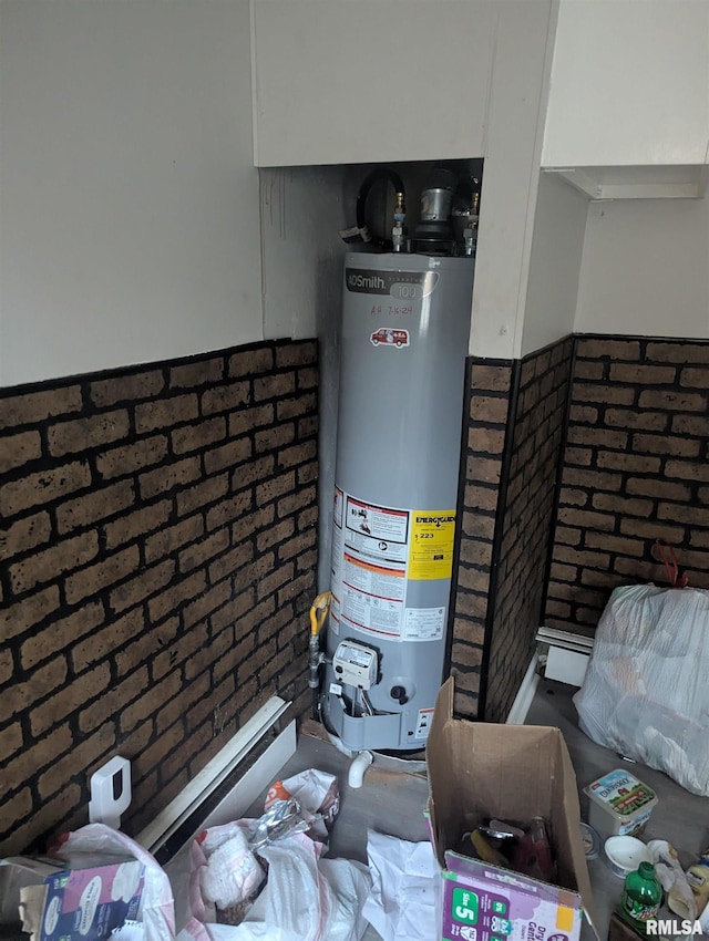 utility room featuring water heater