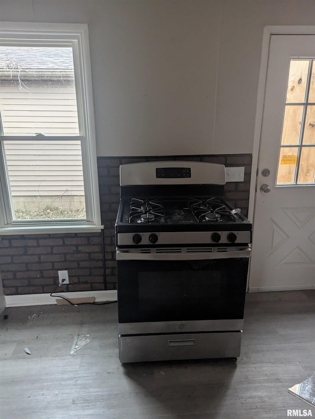 kitchen with plenty of natural light and stainless steel range with gas stovetop