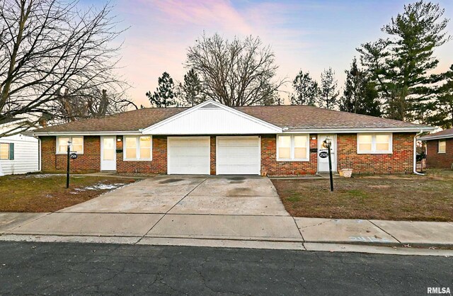 single story home featuring a garage