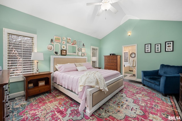 bedroom featuring ensuite bath, vaulted ceiling, and ceiling fan