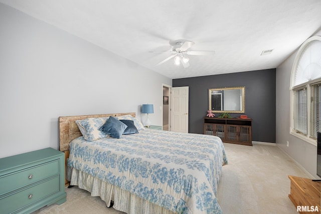 carpeted bedroom with ceiling fan