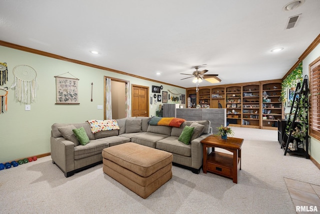 carpeted living room with ceiling fan and crown molding