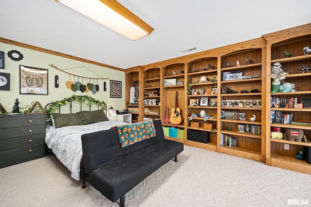 carpeted bedroom featuring crown molding