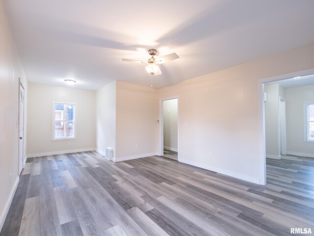 spare room featuring hardwood / wood-style floors and ceiling fan