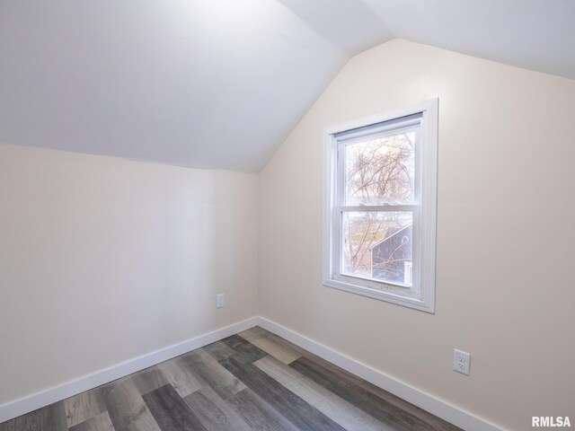 bonus room featuring dark hardwood / wood-style flooring and vaulted ceiling