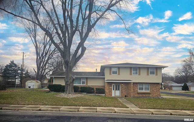 split level home with a yard