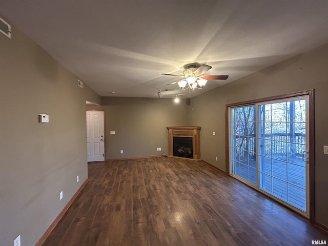 unfurnished living room featuring dark hardwood / wood-style floors and ceiling fan