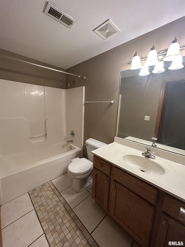 full bathroom featuring tile patterned floors, a textured ceiling,  shower combination, vanity, and toilet