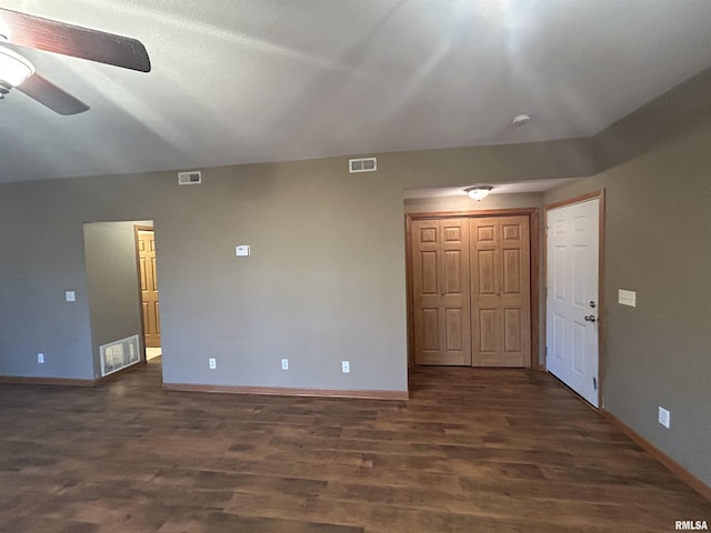 spare room with dark hardwood / wood-style floors and ceiling fan