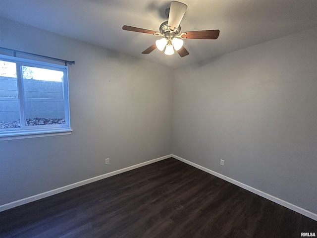 spare room with ceiling fan and dark hardwood / wood-style floors