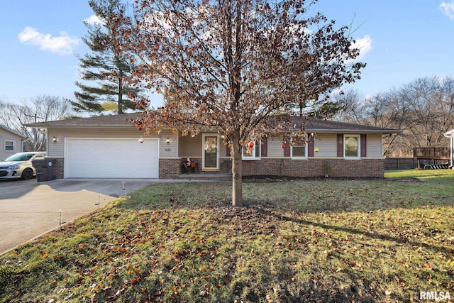 ranch-style house featuring a front yard and a garage