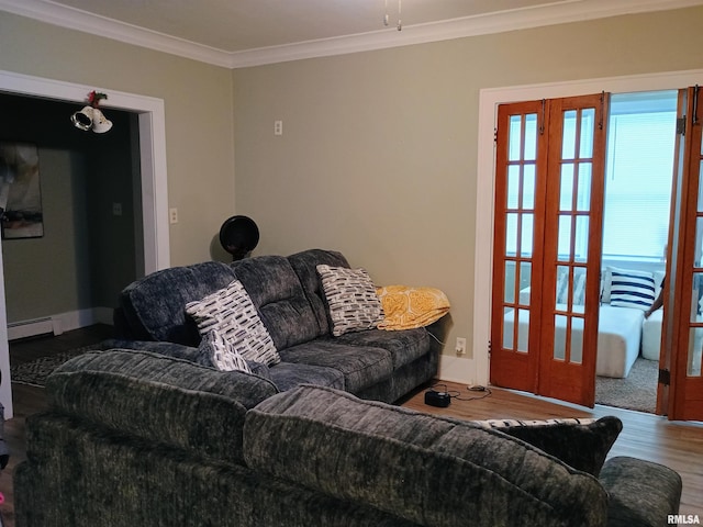 living room featuring hardwood / wood-style floors, baseboard heating, and crown molding