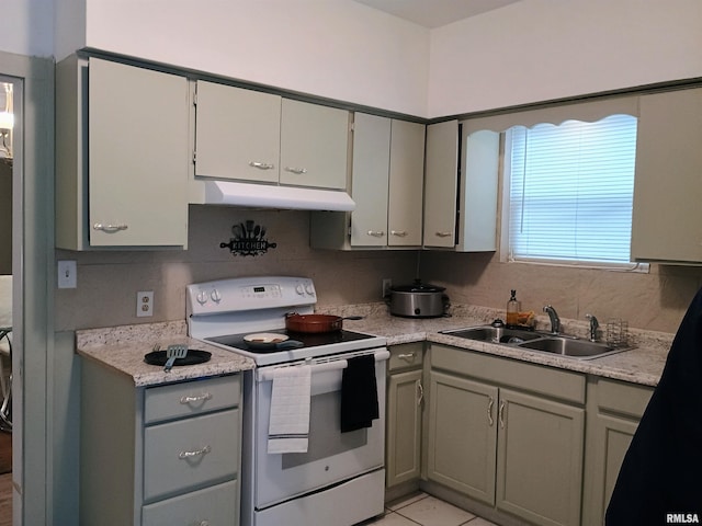 kitchen featuring white range with electric stovetop, gray cabinets, sink, and light tile patterned flooring