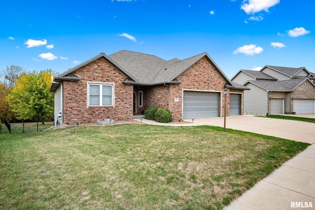 view of front of property featuring a garage and a front yard