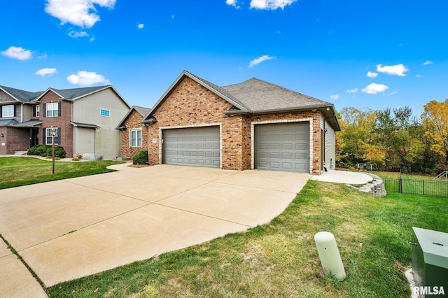 view of front of house with a garage and a front yard