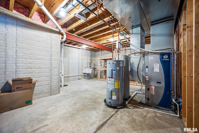 basement featuring sink and water heater