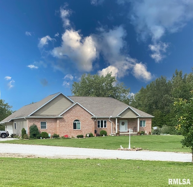 ranch-style home with a front lawn