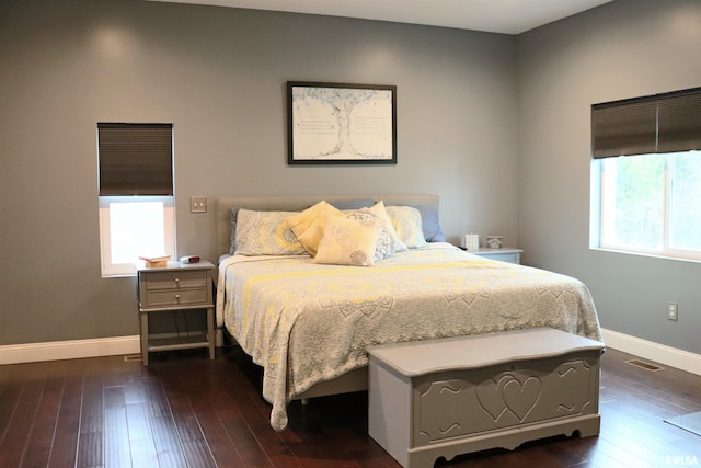 bedroom featuring dark wood-type flooring