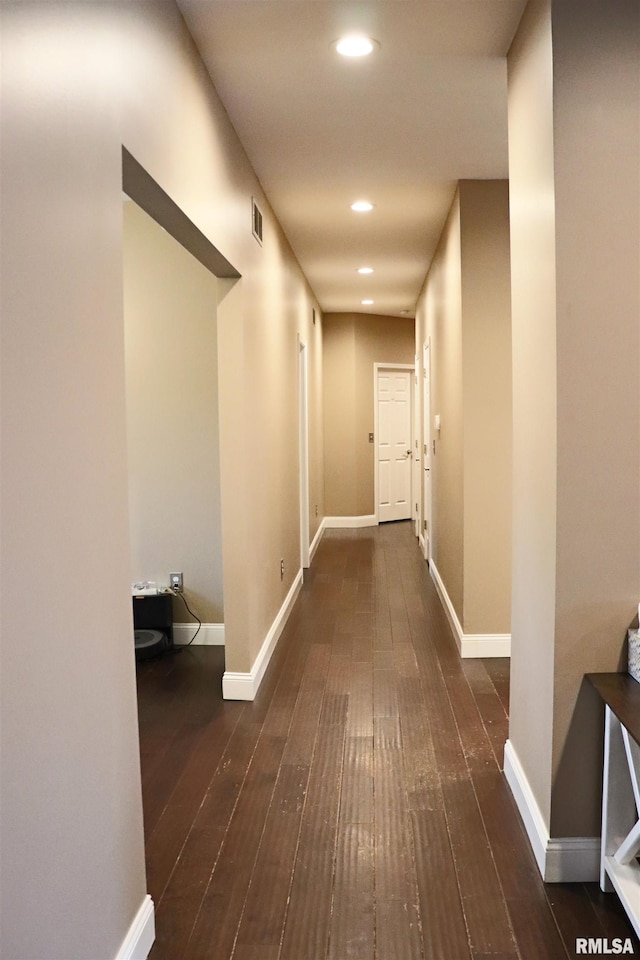 hall with dark hardwood / wood-style flooring