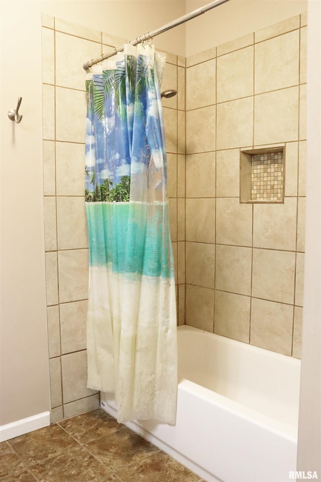 bathroom with shower / bath combination with curtain