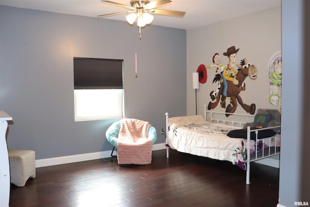 bedroom featuring dark hardwood / wood-style flooring and ceiling fan