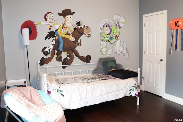 bedroom featuring dark hardwood / wood-style flooring