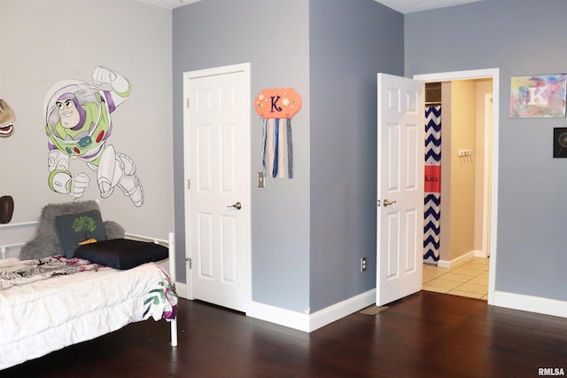 bedroom featuring dark wood-type flooring