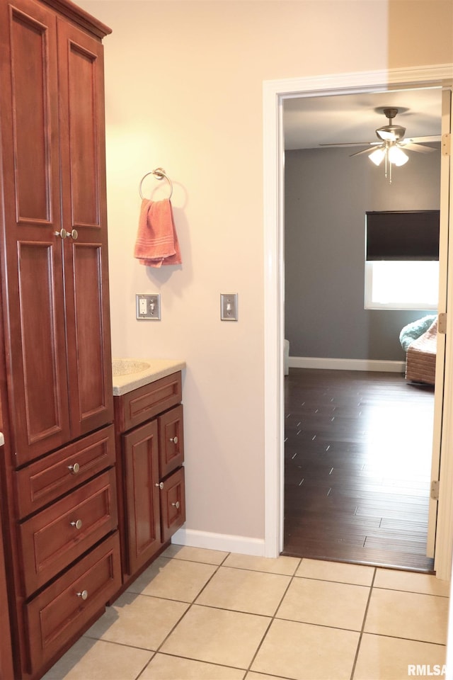 bathroom featuring tile patterned floors and ceiling fan